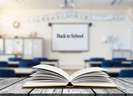 Open book on table with class room background,education concept, Back to schoolの写真素材