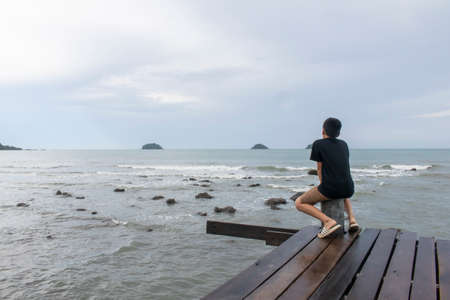 Children seeing the sea,Thailandの写真素材