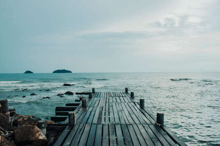 Old wooden Bridge in the seaの写真素材
