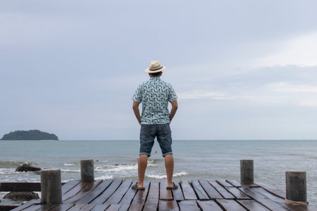 portrait of man standing on the beach at the day time