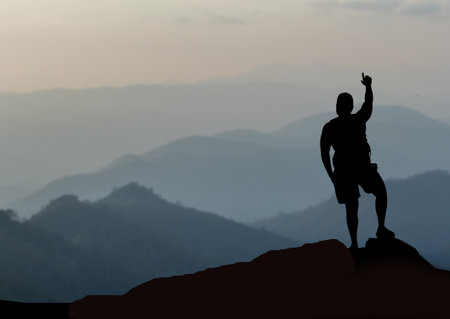 A man standing on top of a mountainの写真素材