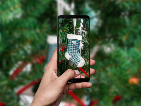 women hand take photo chrismas treeの写真素材