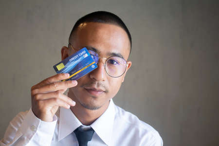 Portrait of business man with cradit cardの写真素材