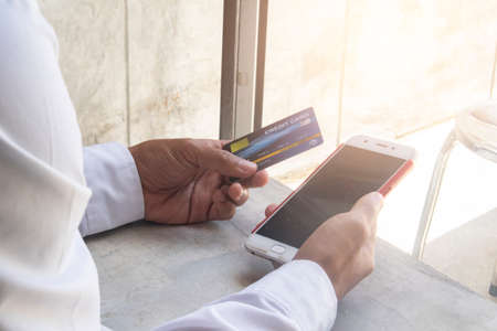 Business man using cradit card with smart phone , Shopping onlineの写真素材