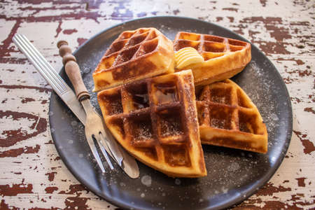 Homemade Belgium waffles served on a plate.の写真素材