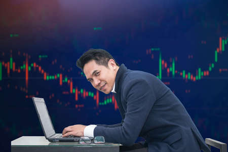 Business man stock exchange trader broker looking at pc computer screen, investor manager analyzing financial chart trading online investment data price crypto currency market graphの写真素材