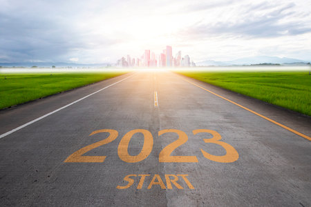 Empty asphalt road and New year 2023 concept.  City skyline with skyscrapers in the background. Plan, goal, task and path to success as you enter the new yearの写真素材
