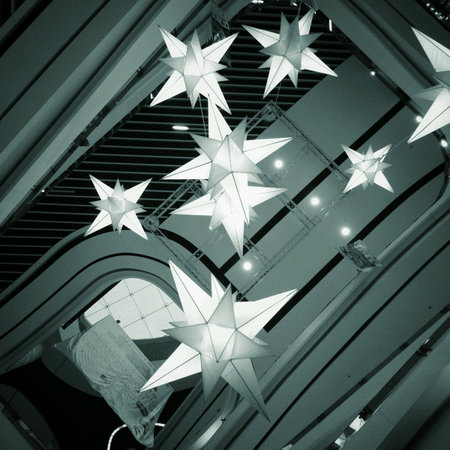 Looking up shot to the ceiling with star shape-lamps