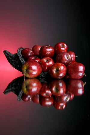 reflection of red applesの写真素材