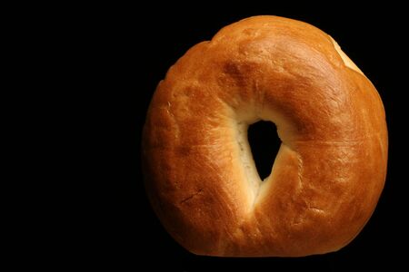 plain bagel on blackの写真素材
