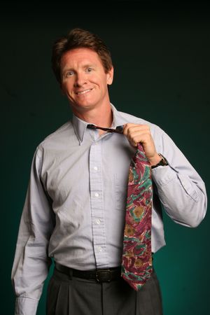 man taking off his tieの写真素材