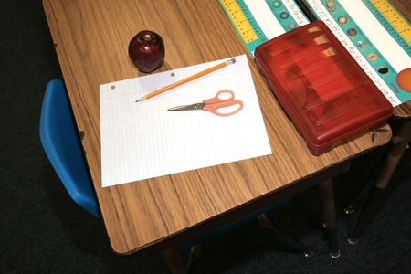 student supplied with scissors, pencil, paper their first day back to schoolの写真素材
