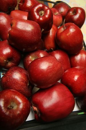 pile of ruby red applesの写真素材
