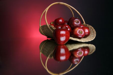 reflection of a full basket of fruitの写真素材
