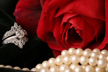 red rose lovely ring and pure pearls on black velvetの写真素材