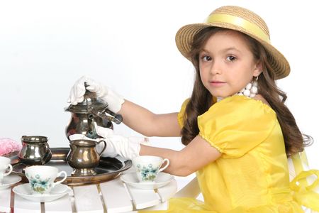 young lady dress for tea in brite yellow with hatの写真素材