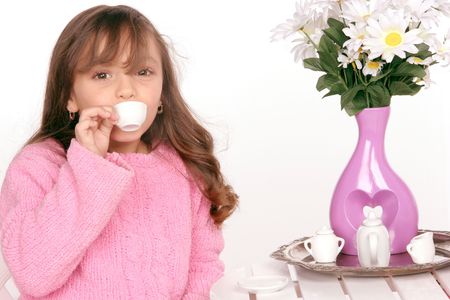 young girl enjoys tea tastingの写真素材