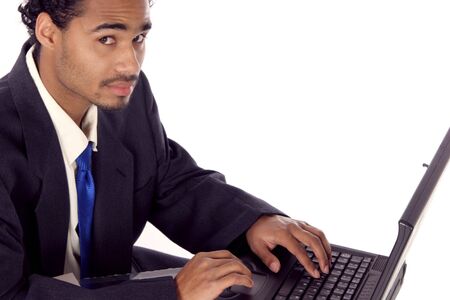young man on his laptop looking at youの写真素材