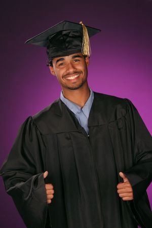 celebrating his achievement this educated graduate puts his thumbs upの写真素材