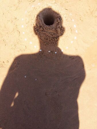 Sand hole at the head of a shadowの素材