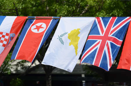 The flags of North Korea, Cyprus and United Kingdomの写真素材