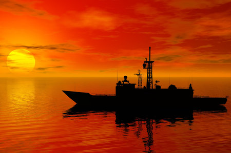 battleship silhouette with sunset behindの写真素材