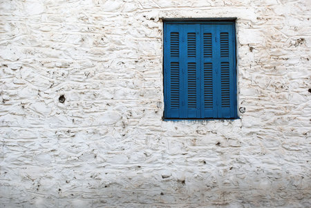 window detail of old greece houseの写真素材