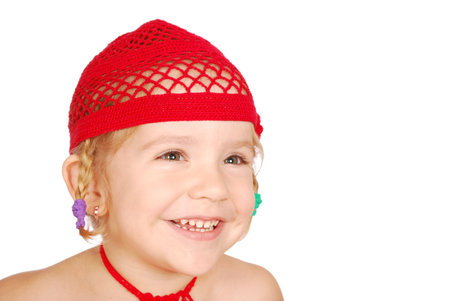 little girl with red knitted hatの写真素材
