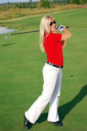 girl playing golfの写真素材