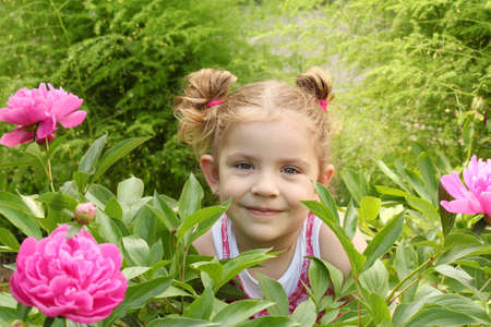 little girl in gardenの写真素材