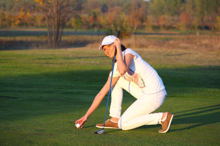 beautiful girl golf player on fieldの写真素材