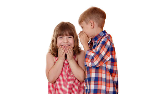 boy whispered little girl funny storyの写真素材