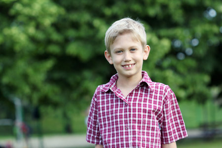 happy boy portrait in park