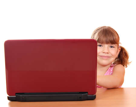 little girl with laptop on whiteの写真素材