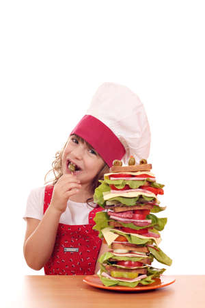 little girl cook eat oliveの写真素材