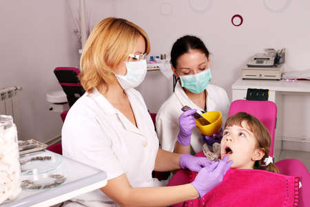 dentist nurse and little girl patientの写真素材