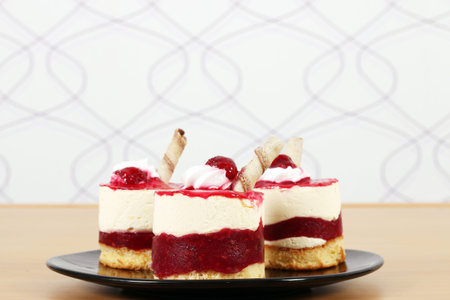 sweet raspberry cake on black plate