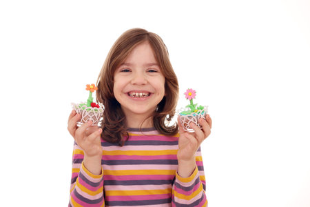 happy little girl with sweet muffinの写真素材