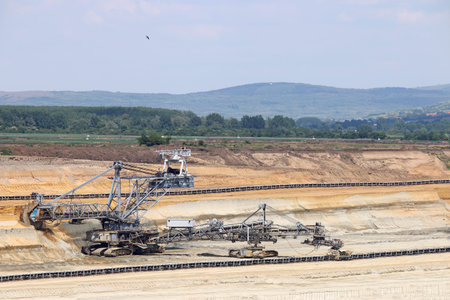 excavator working on open pit coal mine