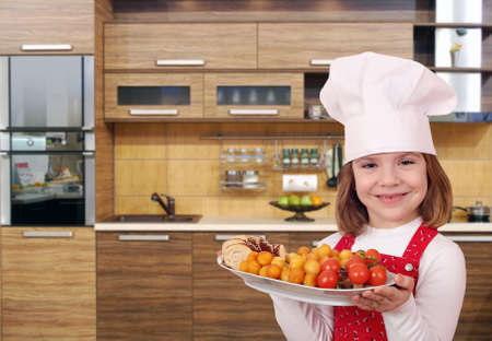 little girl cook with gourmet food in kitchenの写真素材