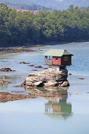 house on rock Drina river Serbiaの写真素材