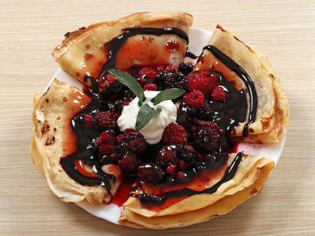 crepes with berries and chocolate dessertの写真素材