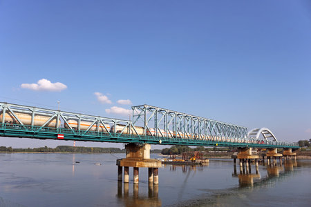 train with tank wagon on bridge