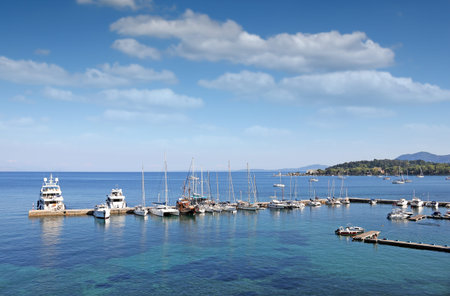 Corfu town marine with yachts and sailboatsの写真素材