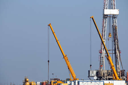 oil drilling rig and cranesの写真素材