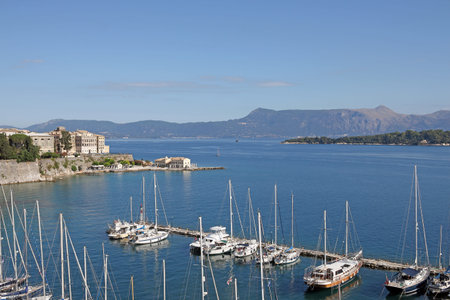 Corfu town port with yachts and sailboatsの写真素材