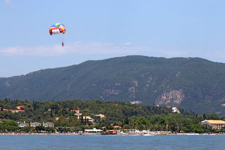 parasailing on blue sky Corfu island summer season