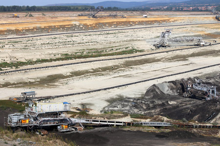 open pit coal mine with machinery and excavators