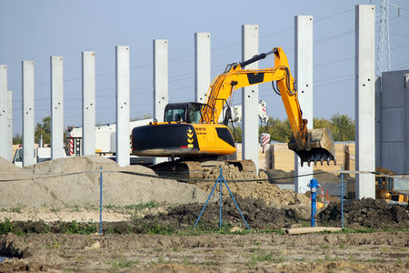 excavator working on new factory construction site