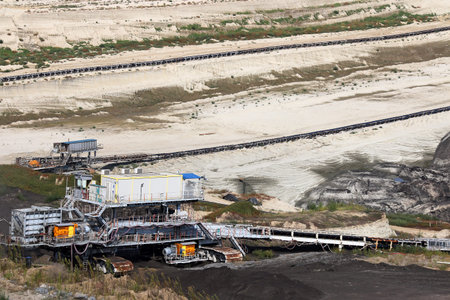 Open pit coal mine with heavy machinery mining industry
